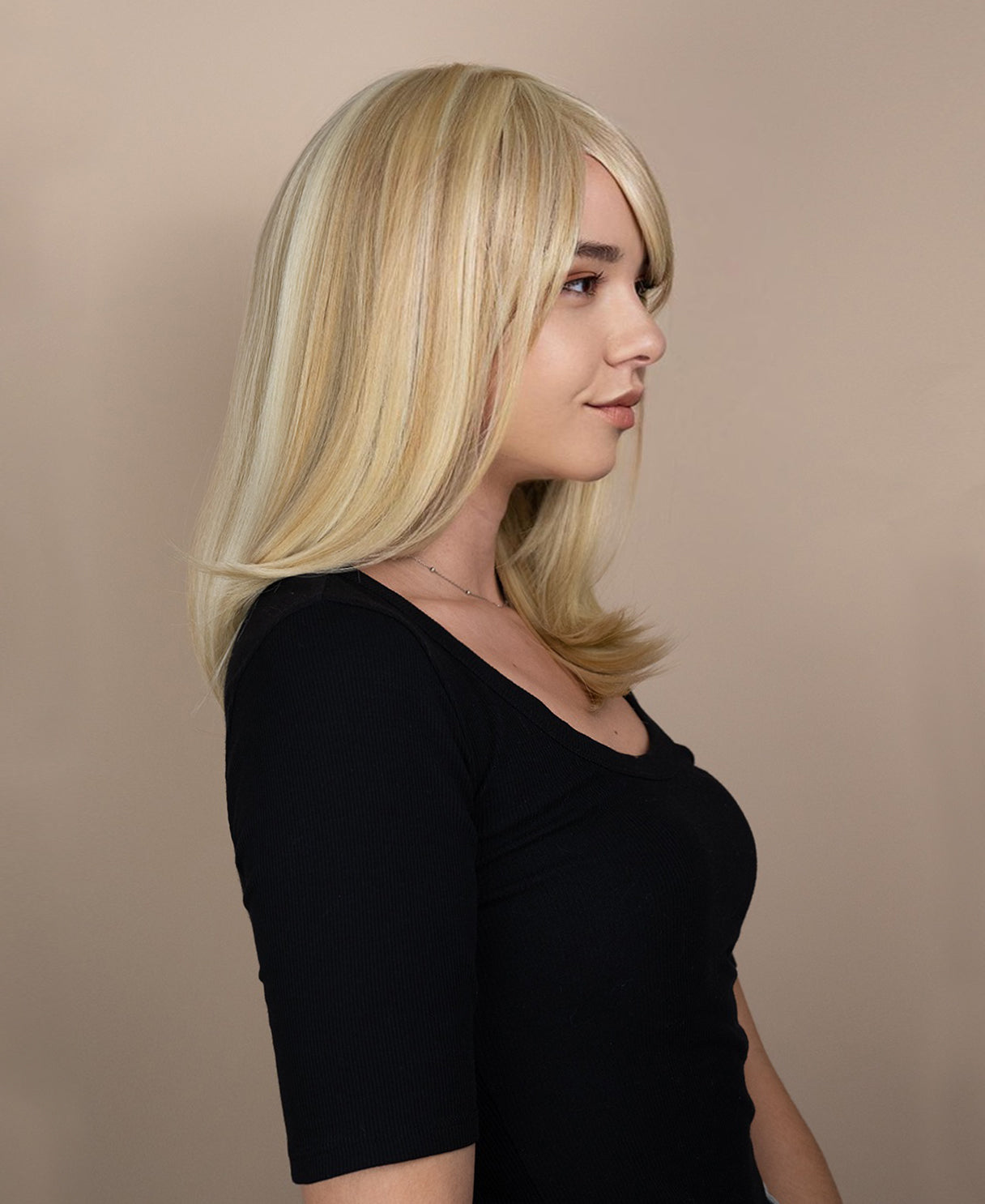 vegan fiber wig with bangs - 16" blonde highlights.