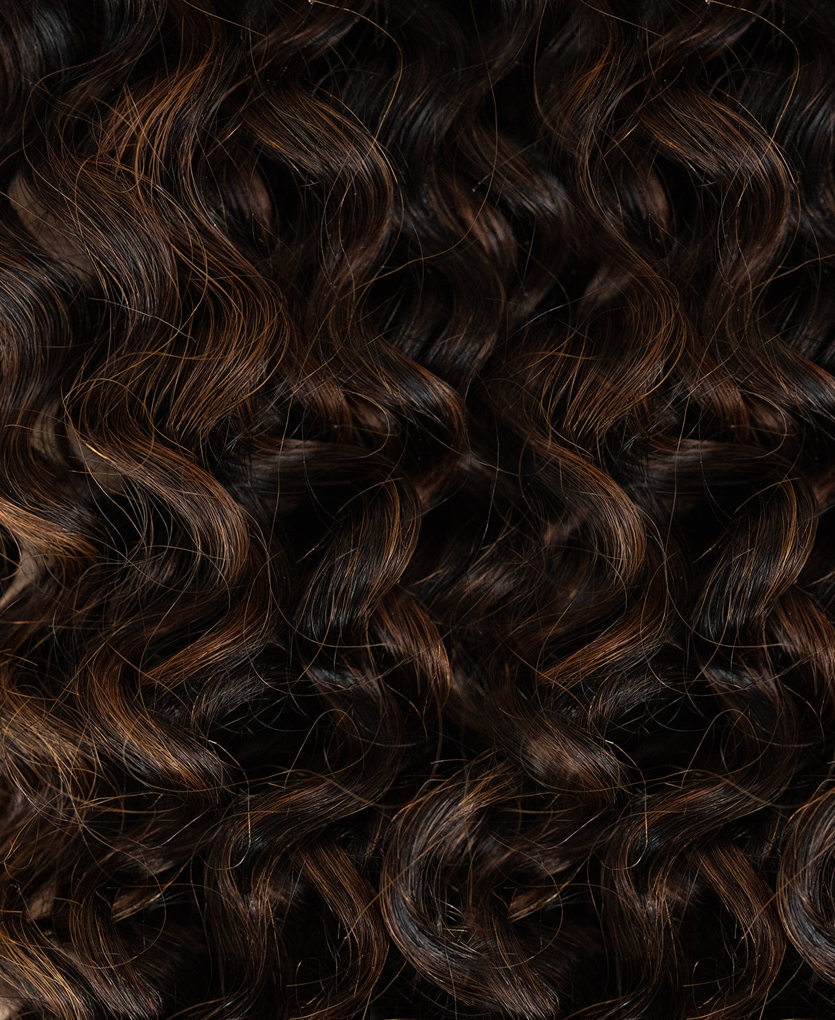 curly (3A curls) tape-in hair extensions mocha balayage.
