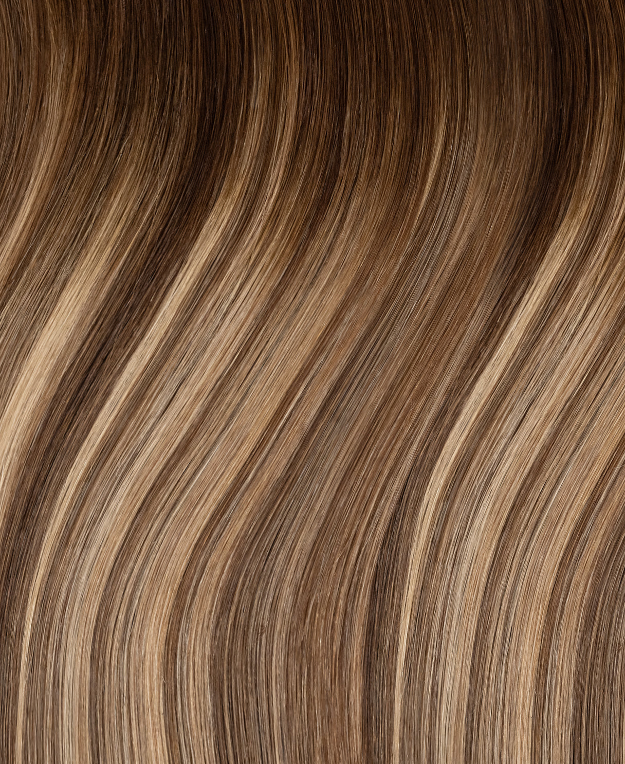 invisible clip-in hair extensions rooted beige highlights.