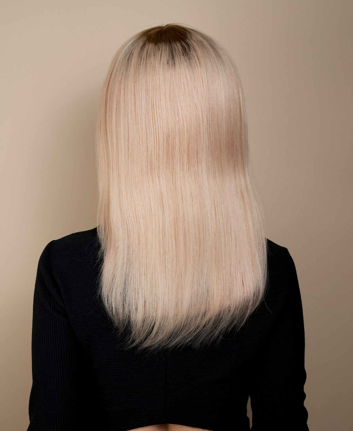 human hair wig with side bangs - 16" rooted blonde.