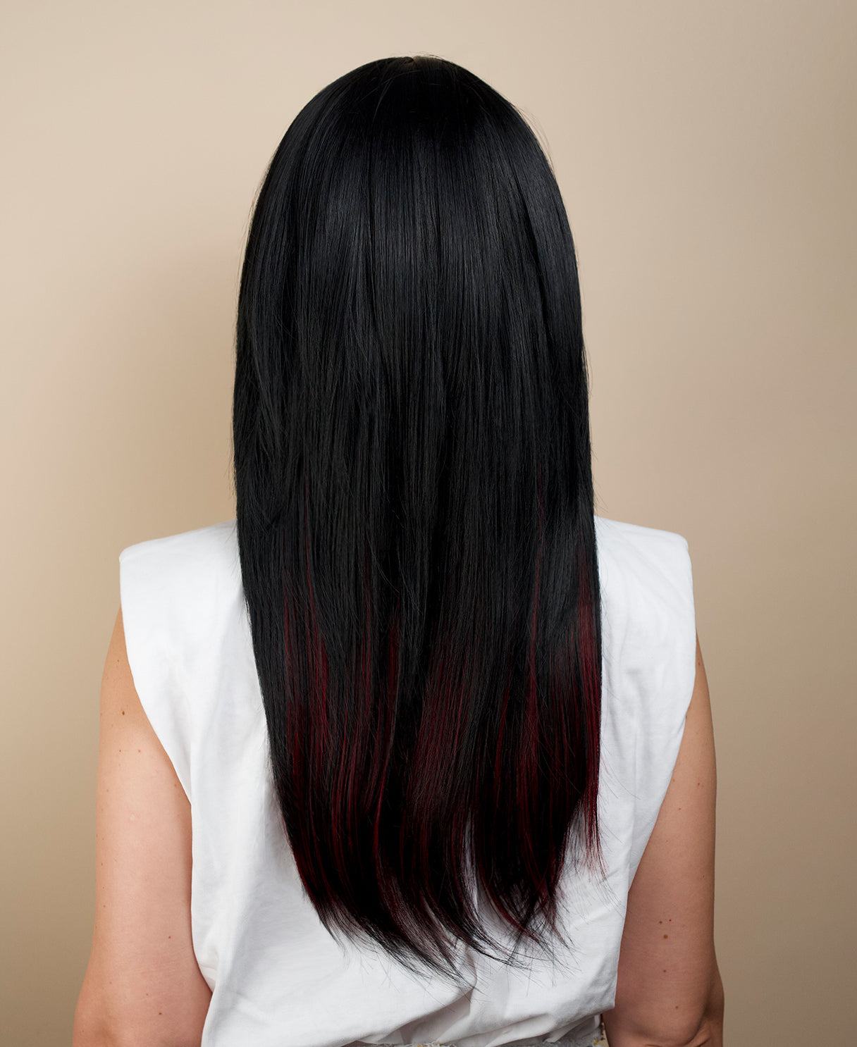 vegan fiber wig - 20" layered black with peekaboo red highlights.