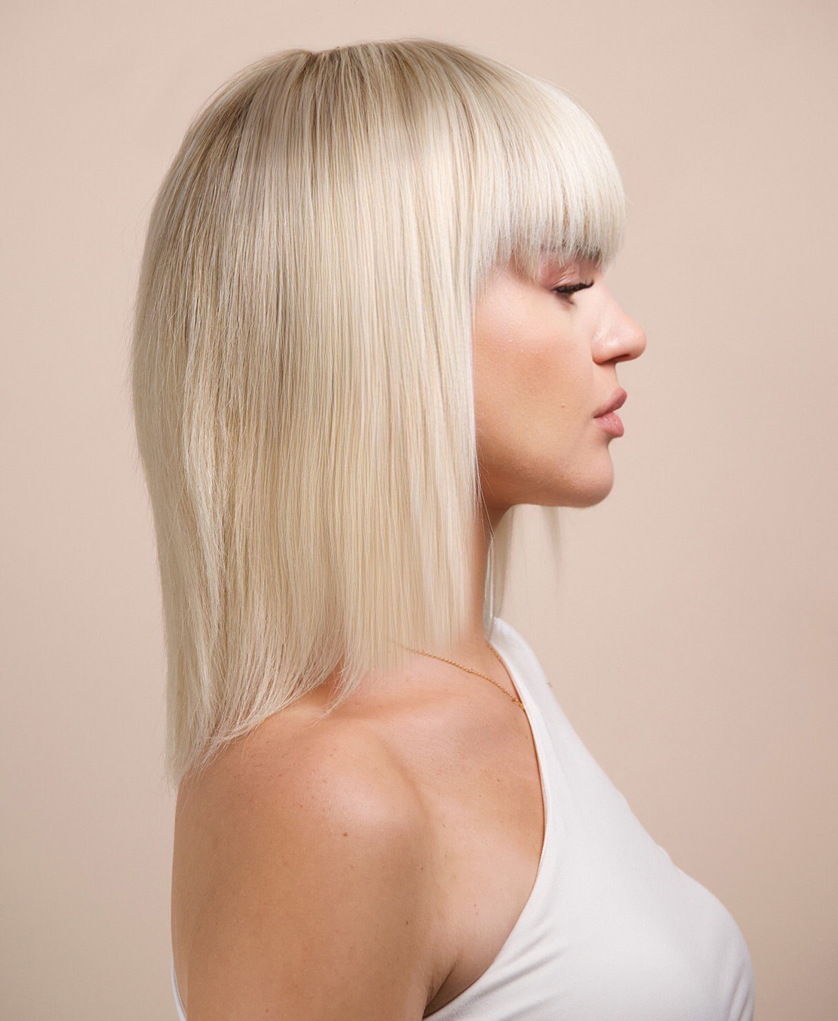 bob wig with fringe - 10" rooted platinum blonde.