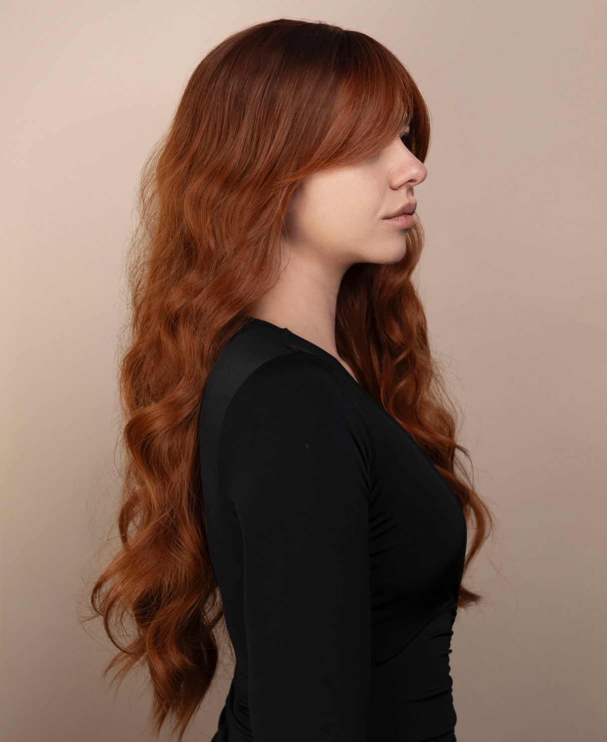 vegan fiber wig - 24" rooted pumpkin spice with curtain bangs.
