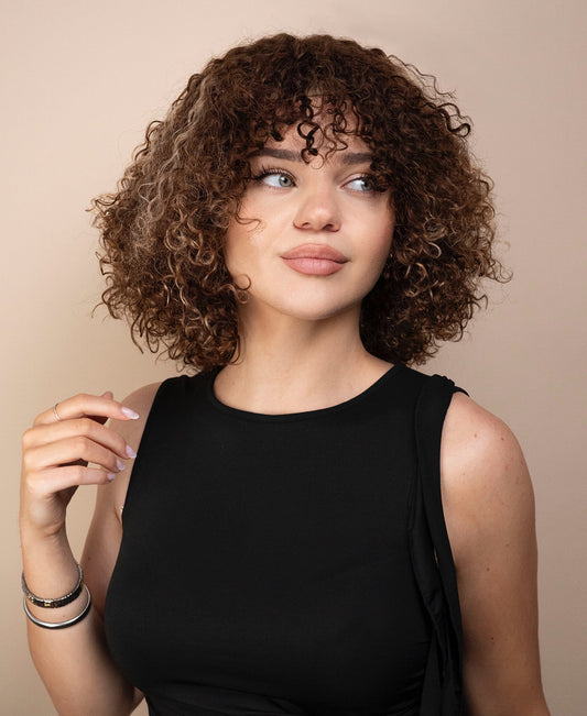 curly human hair wig with bangs - 10" brown balayage.