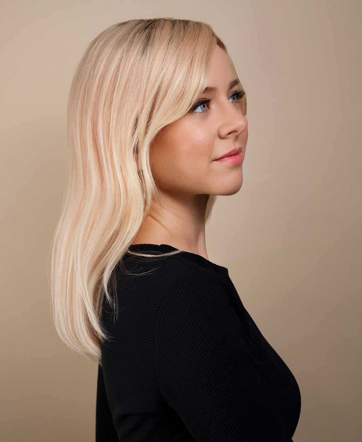 human hair wig with side bangs - 16" rooted blonde.