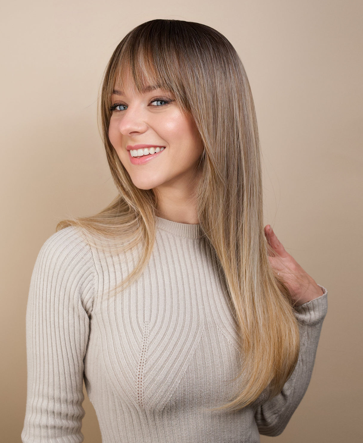vegan fiber wig - 24" rooted medium blonde with layers.