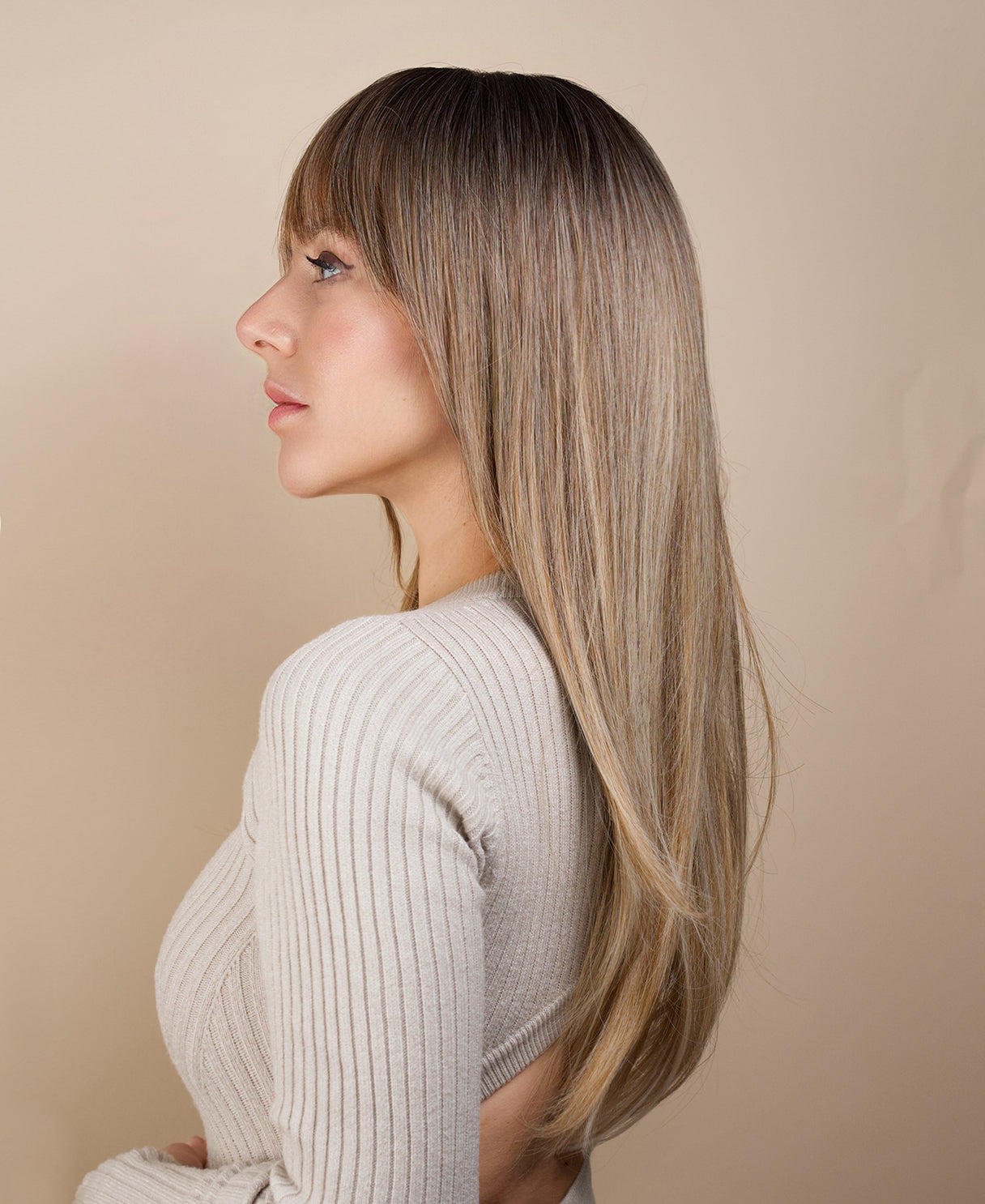 vegan fiber wig - 24" rooted medium blonde with layers.