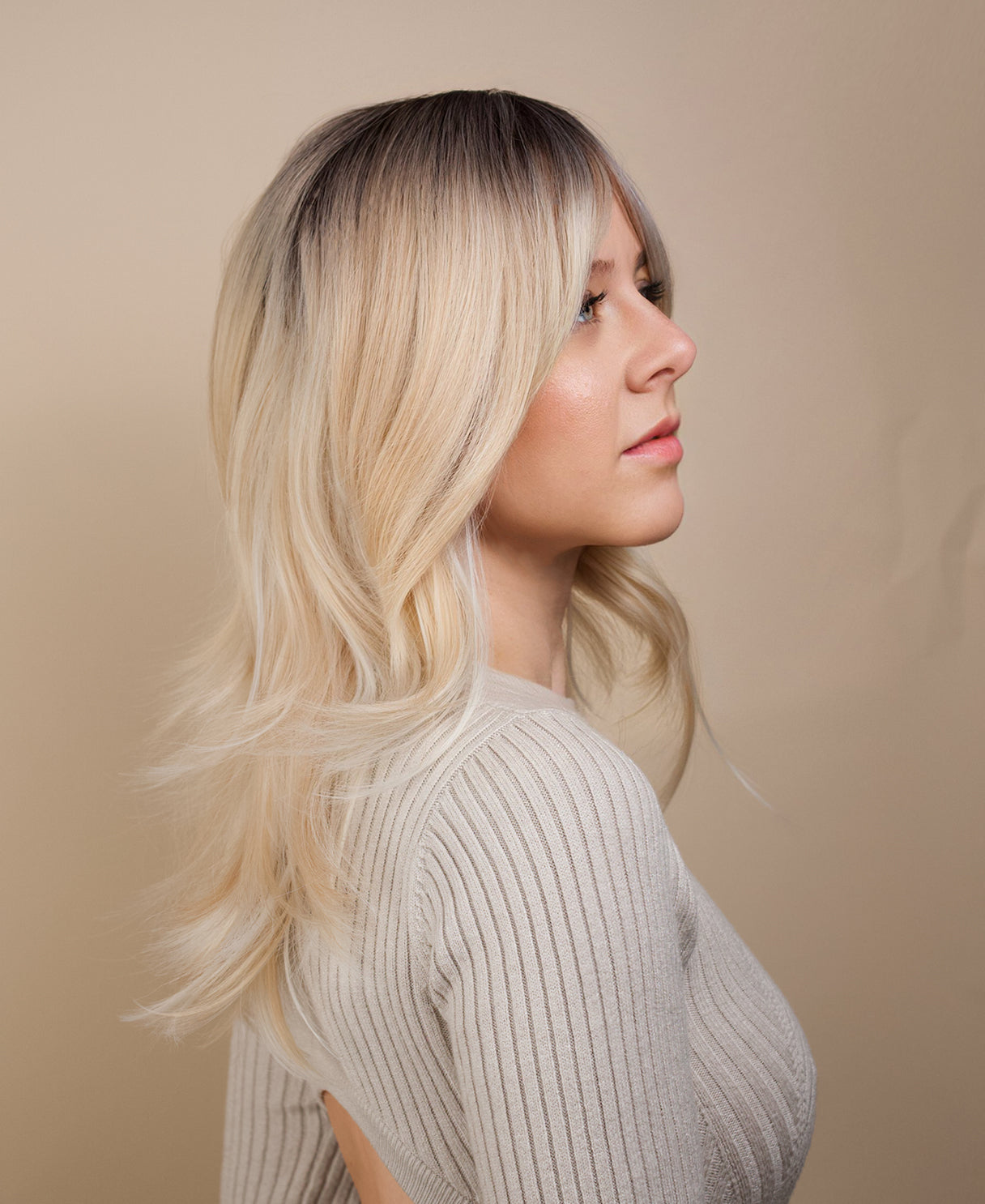 vegan fiber wig - 20" layered rooted blonde.