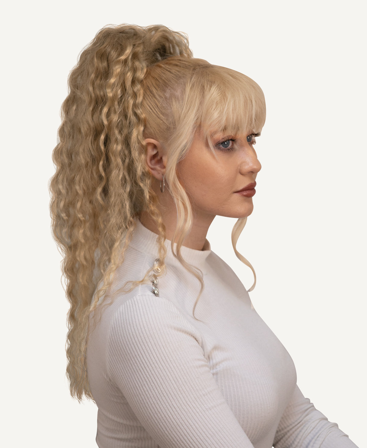 curly ponytail - honey blonde.