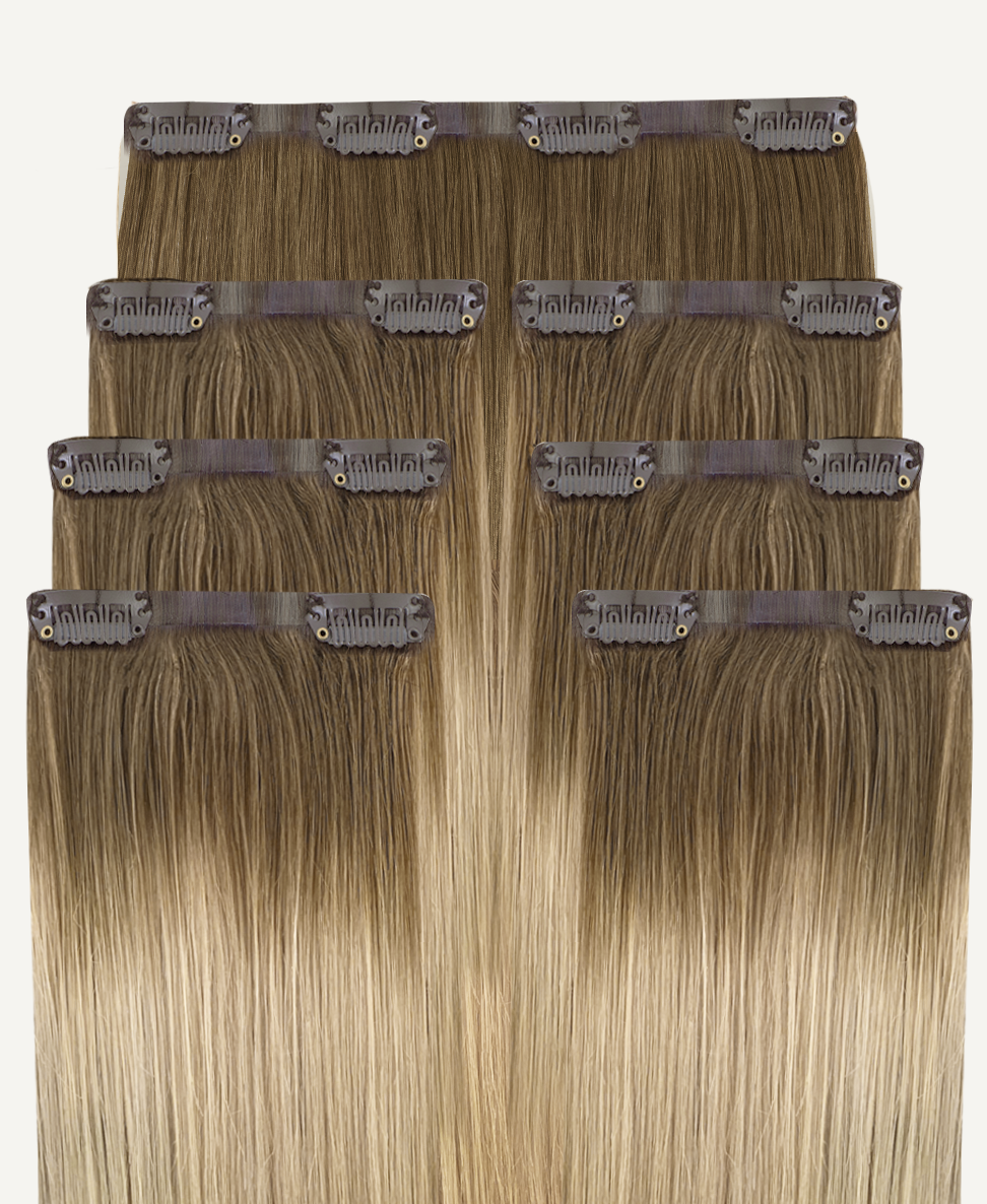 invisible clip-in hair extensions rooted blonde.