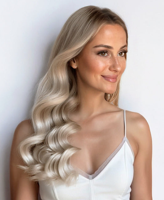 tape-in hair extensions shadow root white blonde.